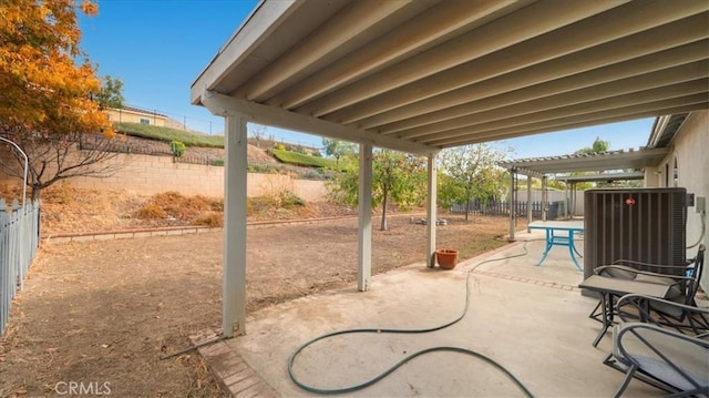 view of patio featuring cooling unit and a pergola