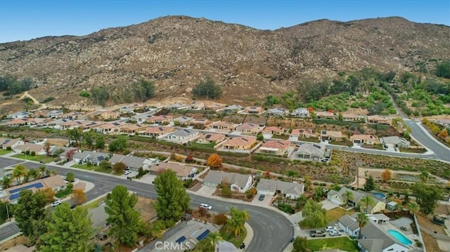 drone / aerial view featuring a mountain view