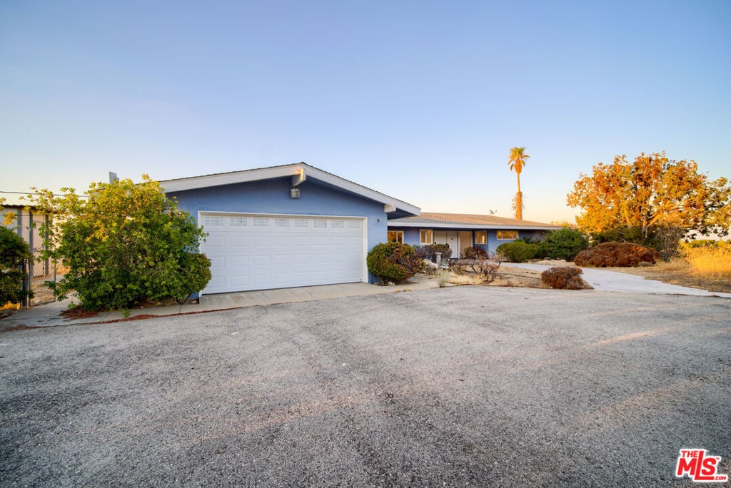 ranch-style home with a garage