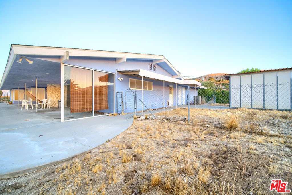 rear view of house with central AC unit