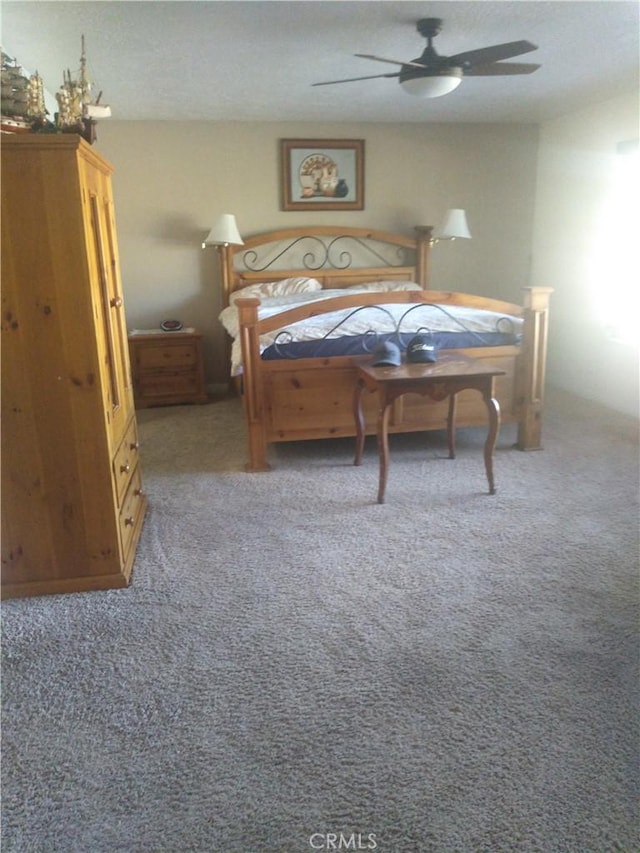 bedroom featuring carpet and ceiling fan