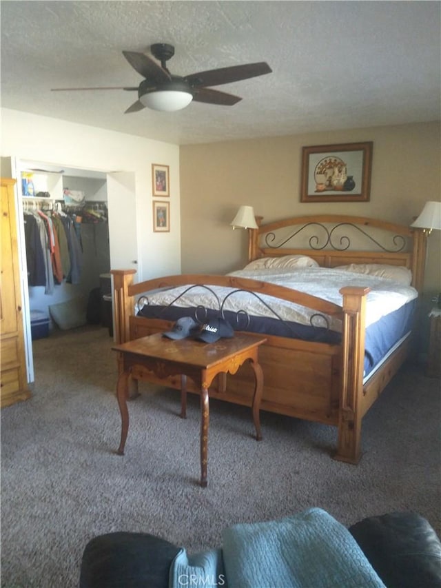 bedroom with carpet, ceiling fan, a textured ceiling, and a closet