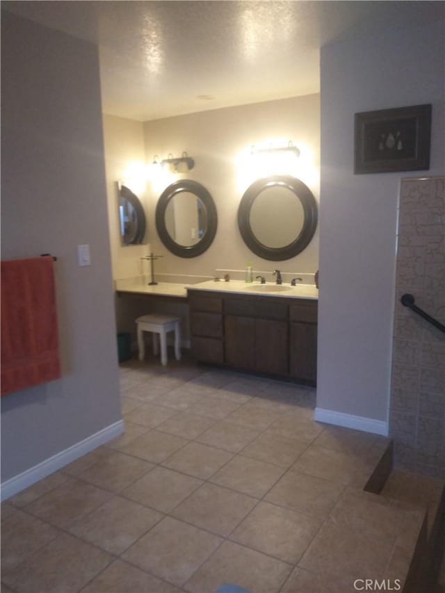 bathroom featuring tile patterned flooring and vanity