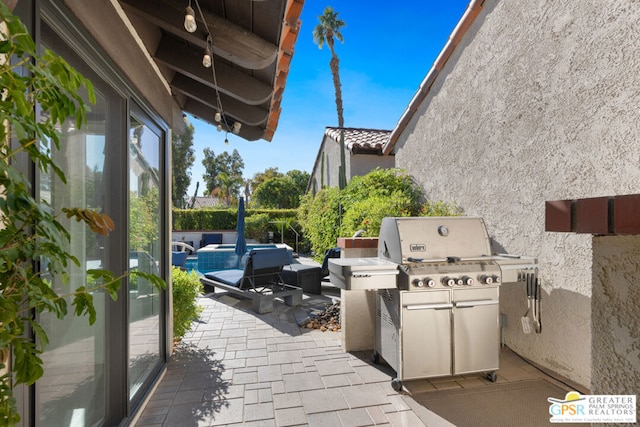 view of patio / terrace featuring an outdoor hangout area and a grill