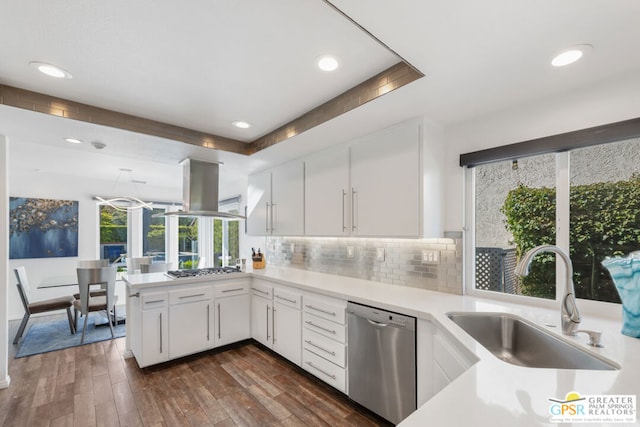 kitchen featuring island range hood, stainless steel appliances, dark wood-type flooring, sink, and white cabinetry