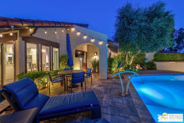 view of patio featuring pool water feature