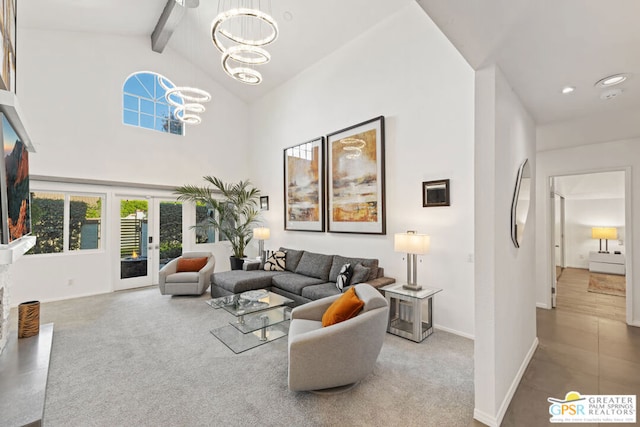 living room featuring a notable chandelier, beam ceiling, carpet floors, and high vaulted ceiling