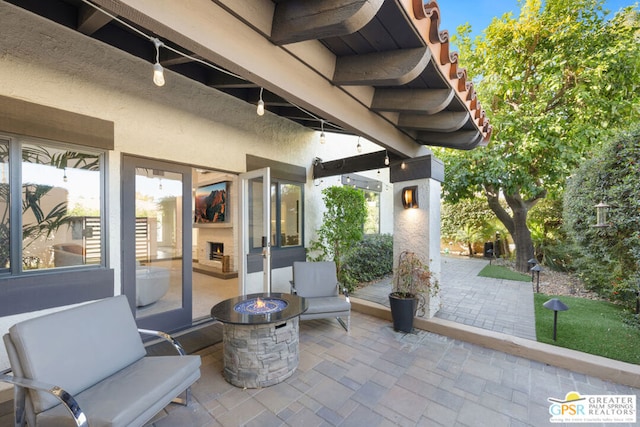 view of patio with a fire pit