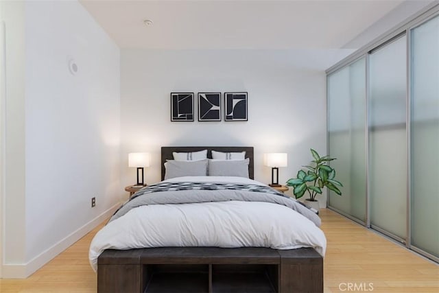 bedroom with light hardwood / wood-style flooring