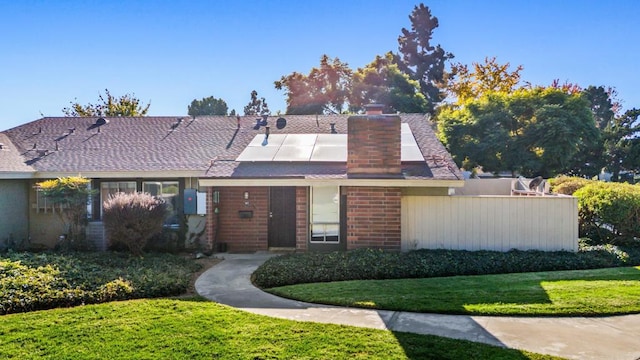 view of front of property with solar panels