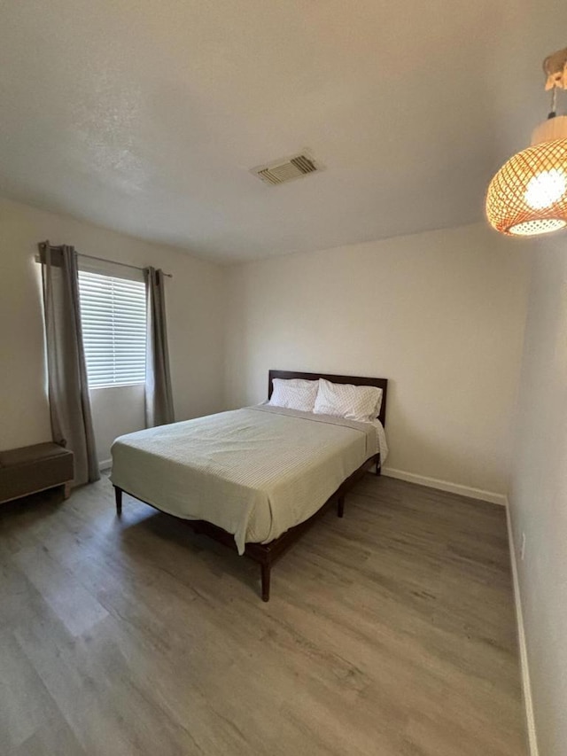 bedroom featuring hardwood / wood-style flooring