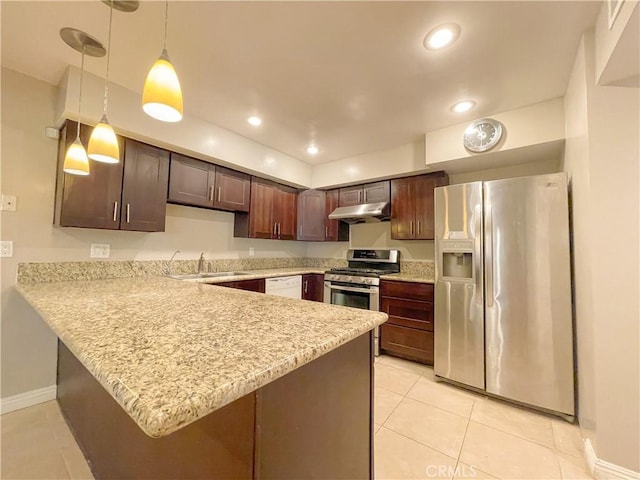 kitchen featuring kitchen peninsula, decorative light fixtures, stainless steel appliances, and dark brown cabinets