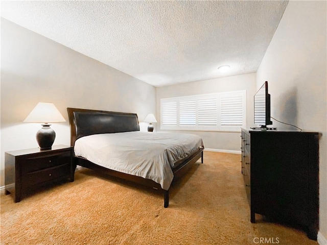 carpeted bedroom with a textured ceiling