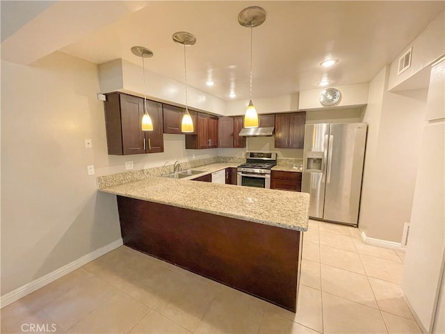 kitchen featuring sink, kitchen peninsula, dark brown cabinets, light tile patterned flooring, and appliances with stainless steel finishes