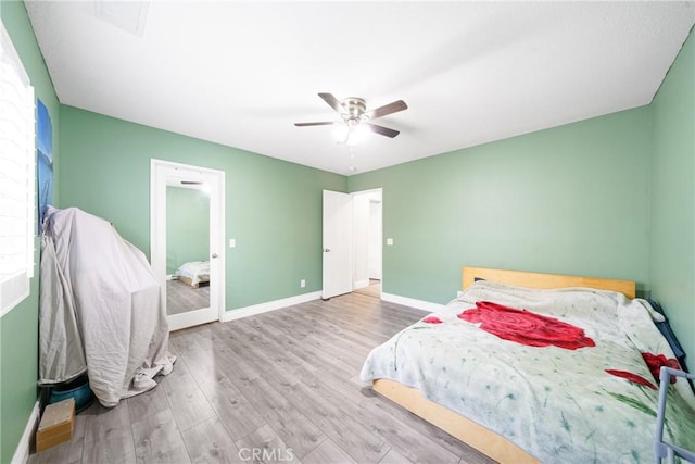 bedroom featuring ceiling fan and light hardwood / wood-style floors