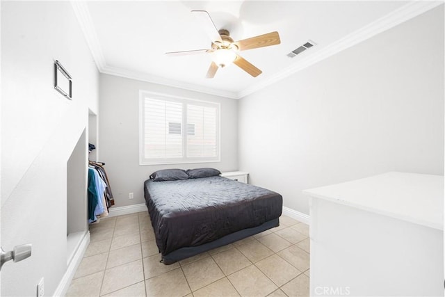 tiled bedroom featuring ceiling fan and crown molding