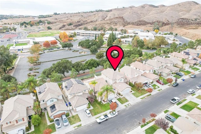 birds eye view of property with a mountain view