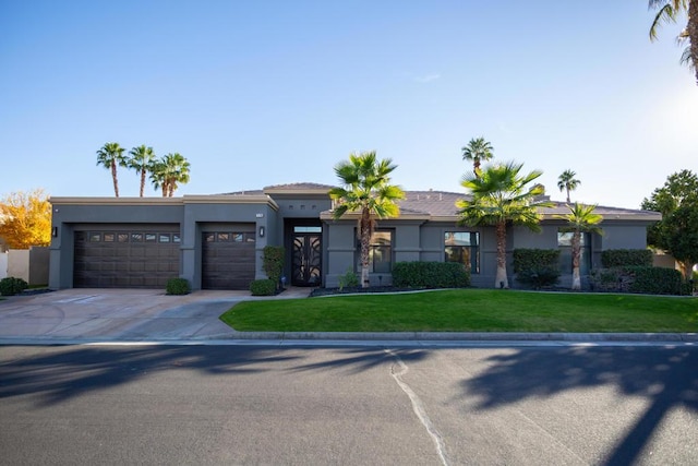 view of front facade featuring a garage and a front yard