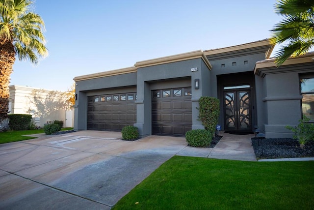 view of front of house featuring a garage and french doors