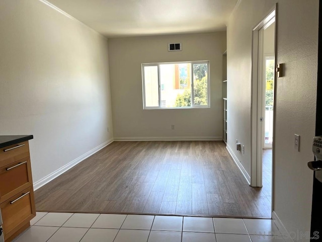 spare room with light hardwood / wood-style flooring