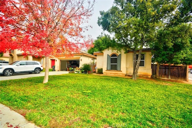 view of front of house featuring a garage and a front yard