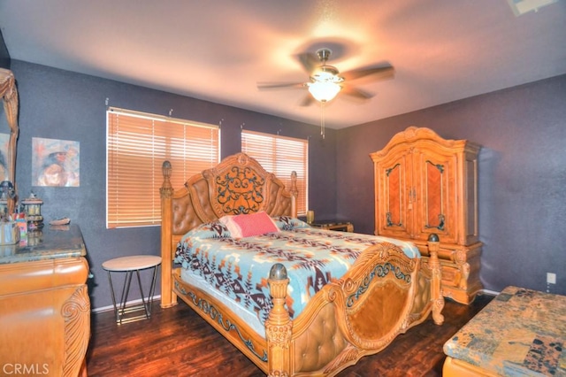 bedroom with ceiling fan and dark hardwood / wood-style flooring