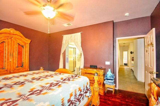 bedroom featuring ceiling fan and wood-type flooring