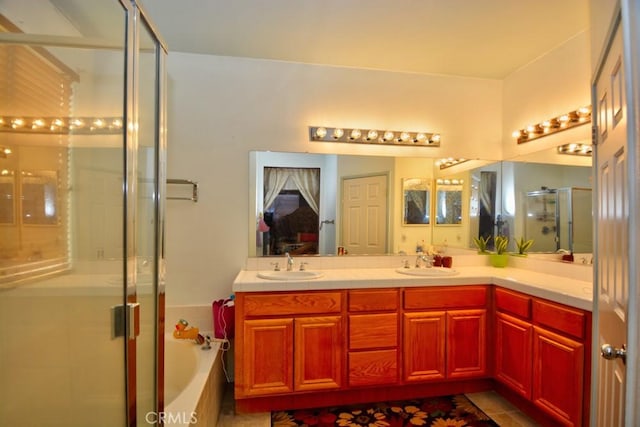 bathroom featuring tile patterned floors, vanity, and plus walk in shower