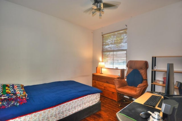 bedroom featuring dark wood-type flooring and ceiling fan