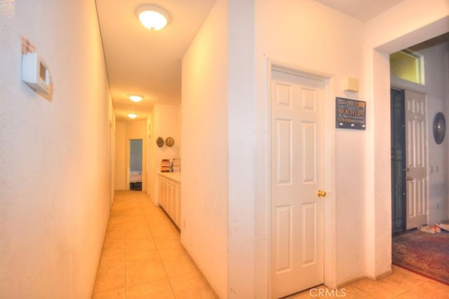 hallway featuring light tile patterned floors