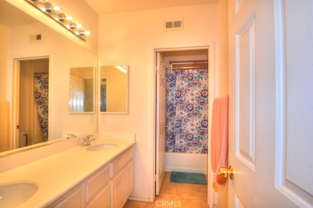 bathroom with tile patterned floors, vanity, and shower / bath combo