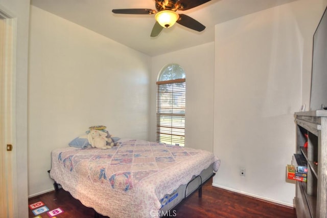 bedroom featuring ceiling fan and dark hardwood / wood-style floors