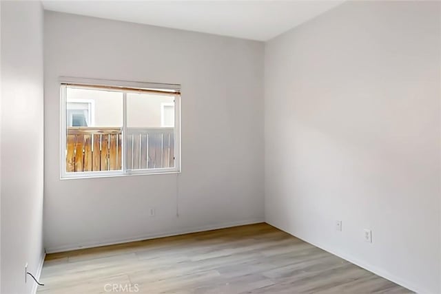 empty room with light wood-type flooring