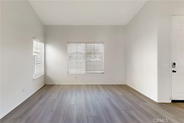 unfurnished room featuring light hardwood / wood-style floors