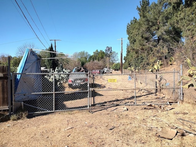 exterior space with fence and a gate