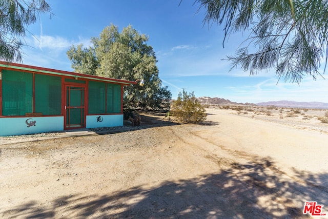 exterior space featuring a mountain view