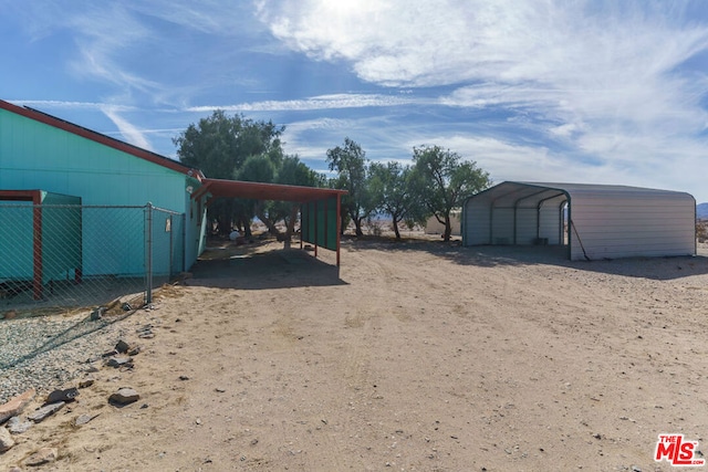 view of yard featuring a carport