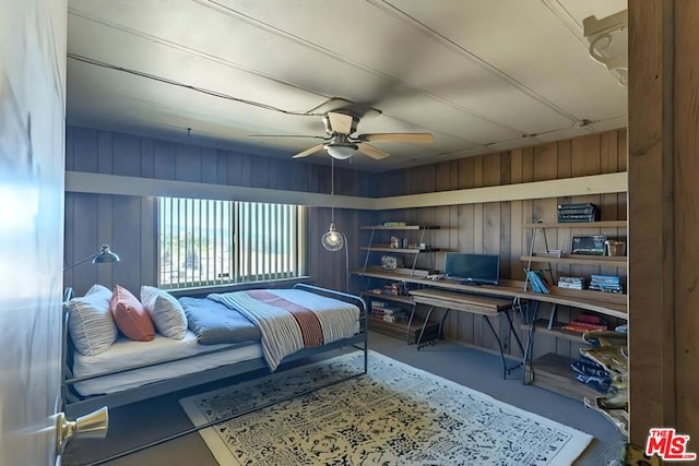 bedroom with concrete flooring and ceiling fan