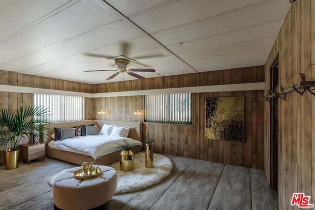 bedroom with wood walls