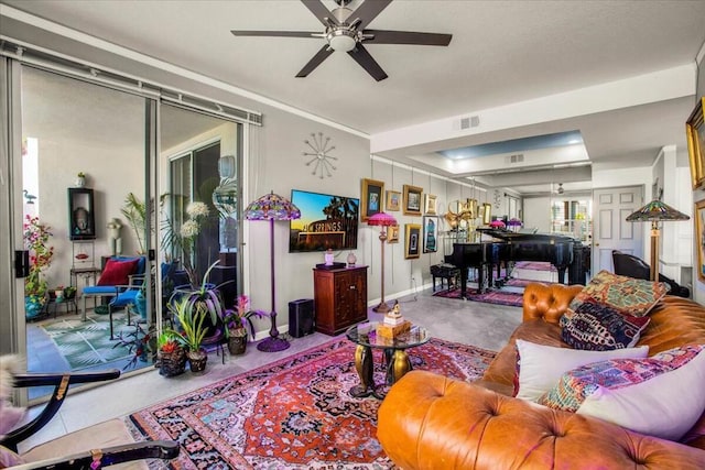 living room featuring concrete flooring and ceiling fan