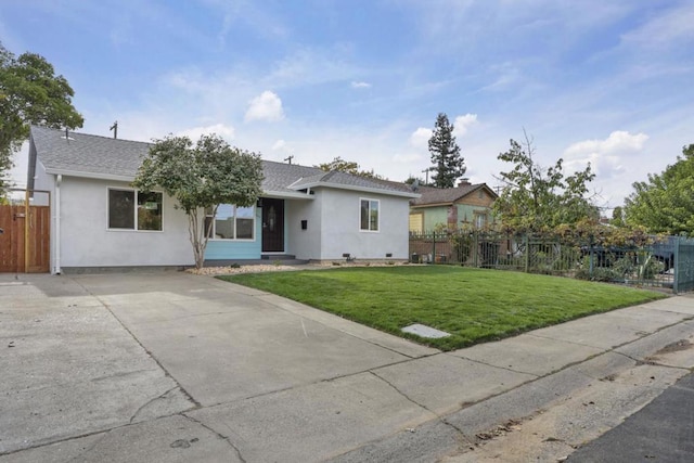 ranch-style house featuring a front lawn