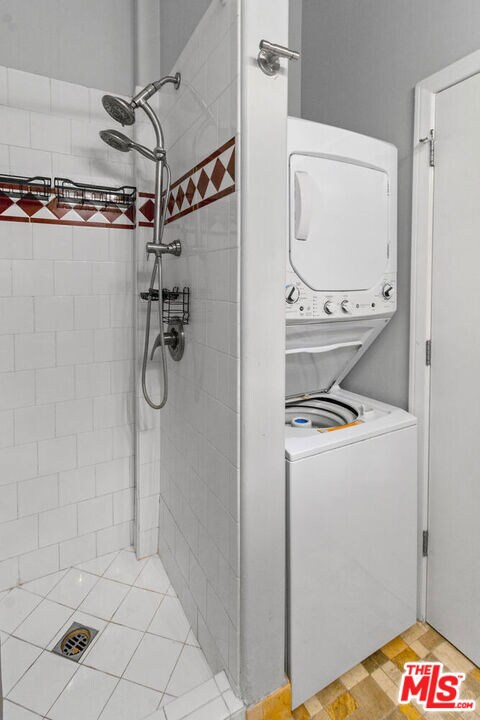 washroom with stacked washer and clothes dryer