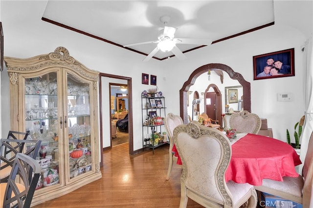 dining space featuring ceiling fan and hardwood / wood-style flooring