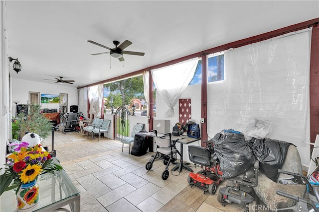 sunroom / solarium with ceiling fan