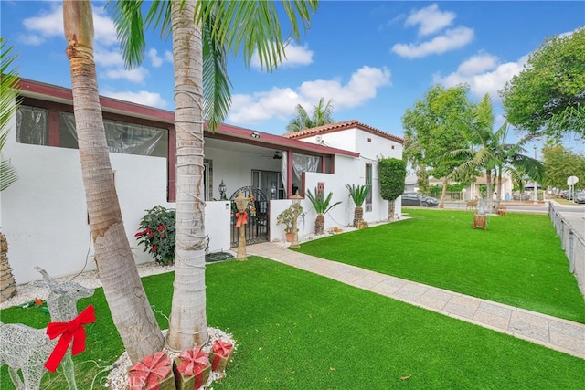 rear view of property with a lawn