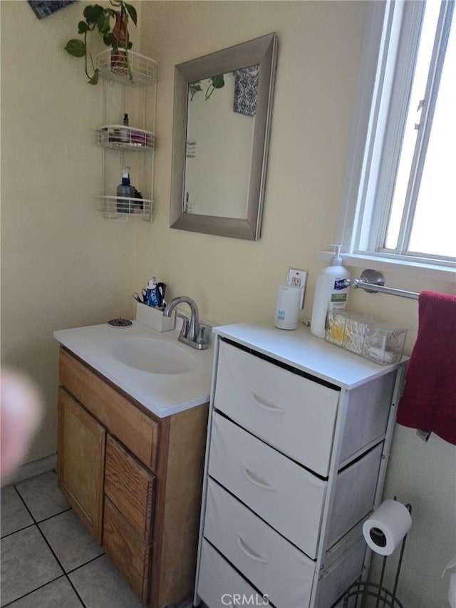 bathroom with tile patterned floors and vanity