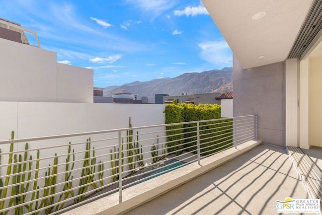 balcony featuring a mountain view