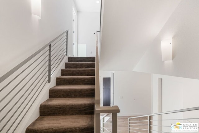 staircase featuring hardwood / wood-style flooring