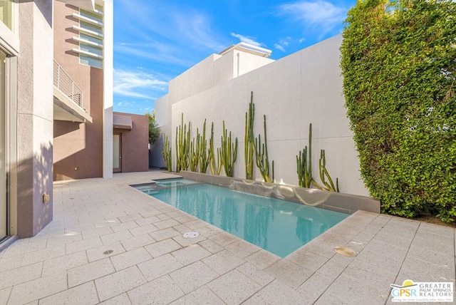 view of pool featuring a patio