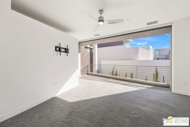 interior space with carpet flooring and ceiling fan